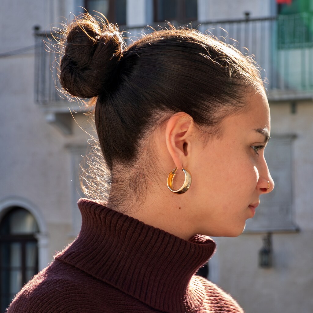 Photo of a woman with a bun in her hair