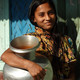 Photo of a woman with a water jug