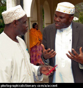 Photo of men talking.