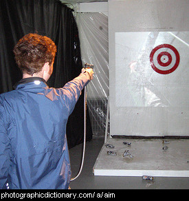 Photo of someone aiming at a target