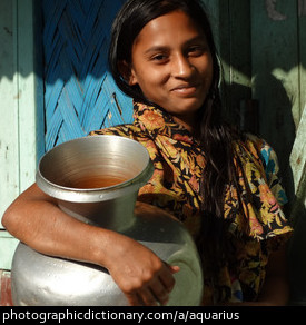 Photo of a woman with a water jug