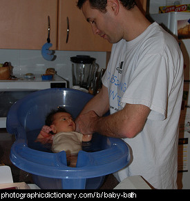 Photo of a baby being bathed