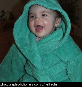 Photo of a child wearing a bathrobe