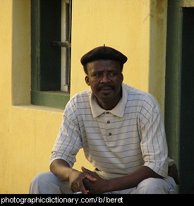 Photo of a man wearing a beret