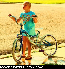 Photo of a girl and a bicycle