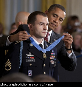 Photo of a man being awarded for bravery