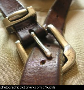 Photo of a buckle on a leather belt