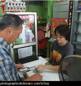 Photo of someone buying some goods