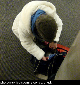Photo of a man checking his bag