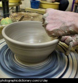 Photo of a potter throwing a bowl