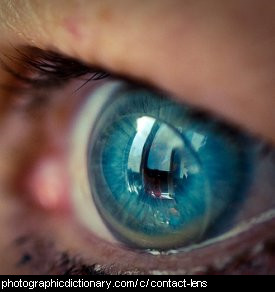 Photo of an eye with a contact lens