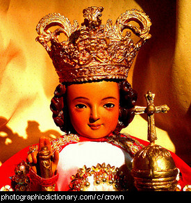 Photo of a doll wearing a crown.