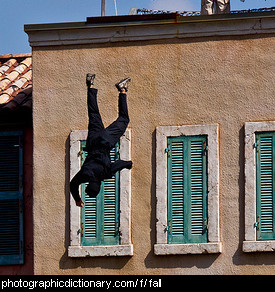 Photo of a man falling off a building