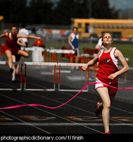 Photo of a woman finishing a race