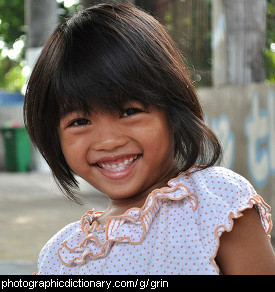 Photo of a little girl grinning
