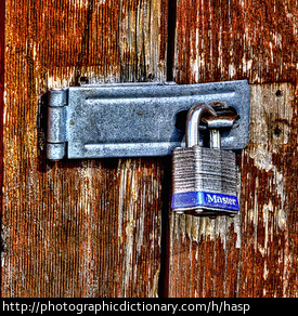 A hasp fitted with a lock.