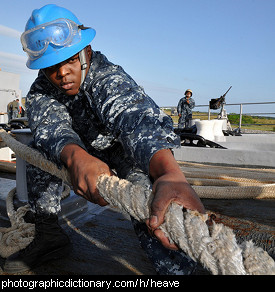 Photo of a sailor heaving a rope