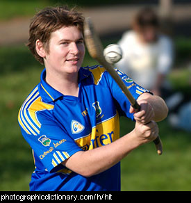 Photo of a man hitting a ball