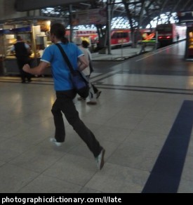 Photo of a man running for the train