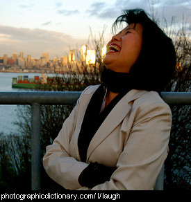 Photo of a woman laughing.