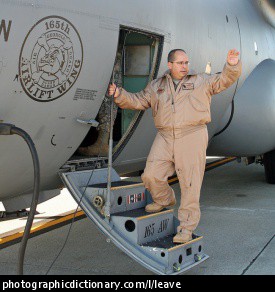 Photo of a man leaving on a plane.