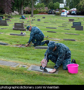 Photo of soldiers maintaining graves