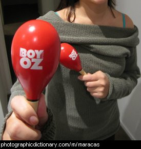 Photo of a woman playing maracas