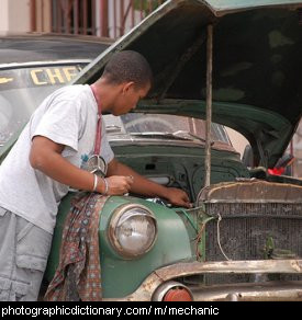 Photo of a mechanic fixing a car