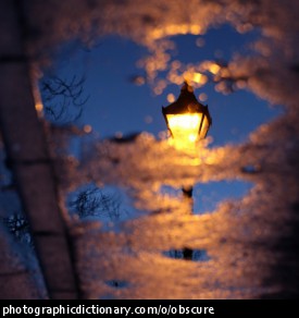 Photo of a lampost obscured by clouds