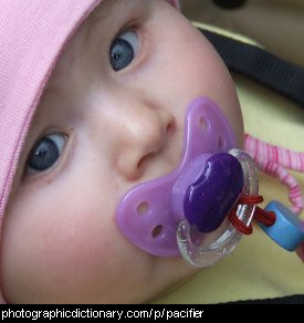 Photo of a baby with a pacifier