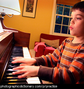 Photo of a boy practicing piano