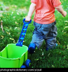 Photo of a little girl pulling a trolley