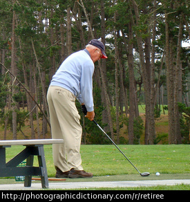 Photo of an older man playing golf