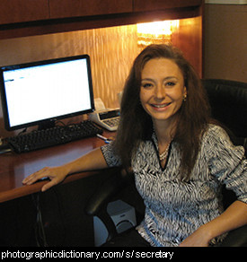 Photo of a secretary at her desk
