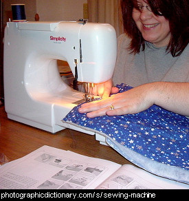 Photo of a woman using a sewing machine