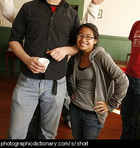 Photo of a short woman next to a tall man