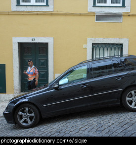 Photo of a car parked on a slope