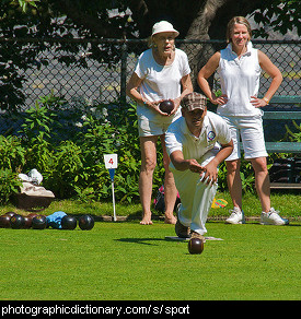 Photo of people playing lawn bowls