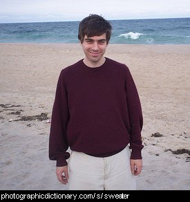 Photo of a man wearing a sweater.