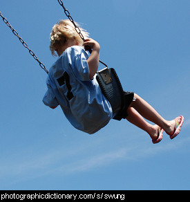 Photo of a girl swinging