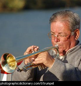 Photo of a man playing a trumpet