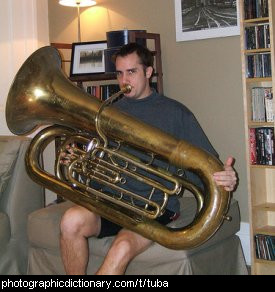 Photo of a man playing a tuba