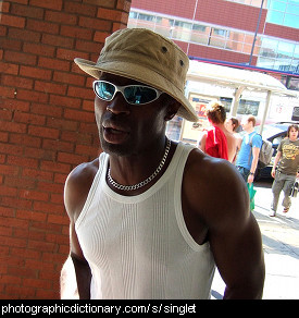 Photo of a man wearing an undershirt