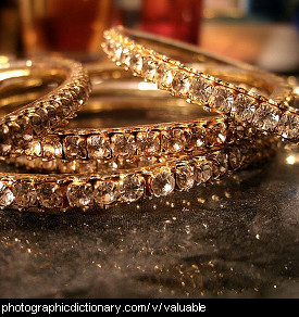 Photo of some gold and diamond bangles