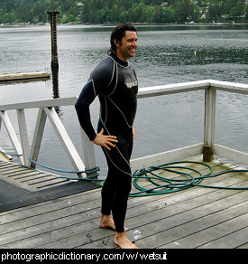 Photo of a man wearing a wetsuit.