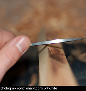 Photo of a man whittling