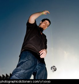 photo of a man playing with a yoyo