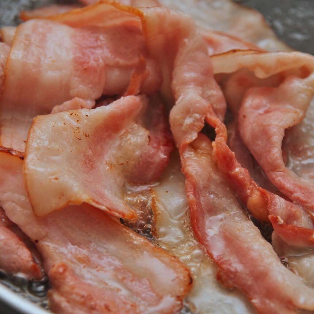 Photo of bacon being fried